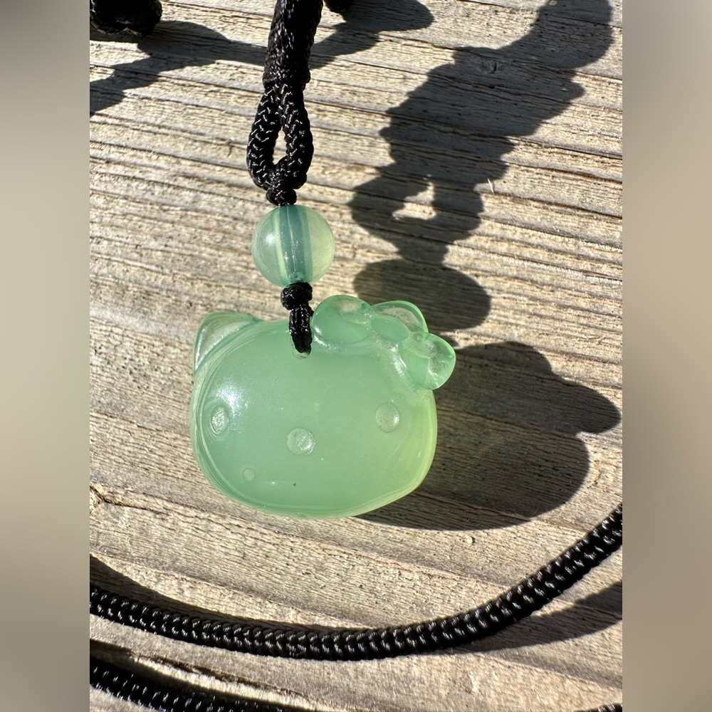 Jade color hello kitty pendant